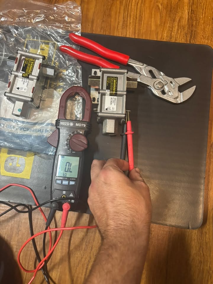 Appliance components being tested with professional diagnostic equipment