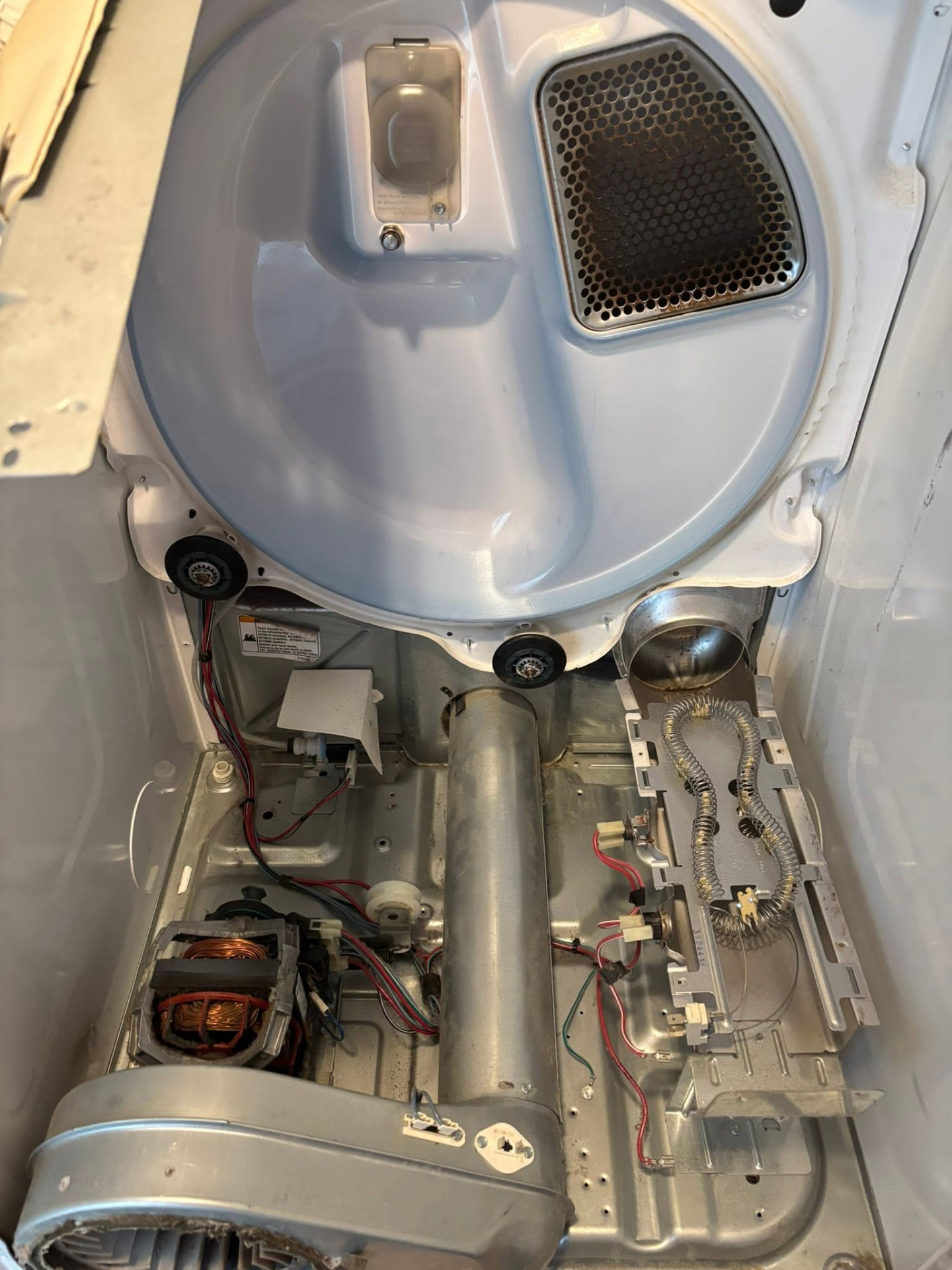 Open dryer interior after cleaning and repair work